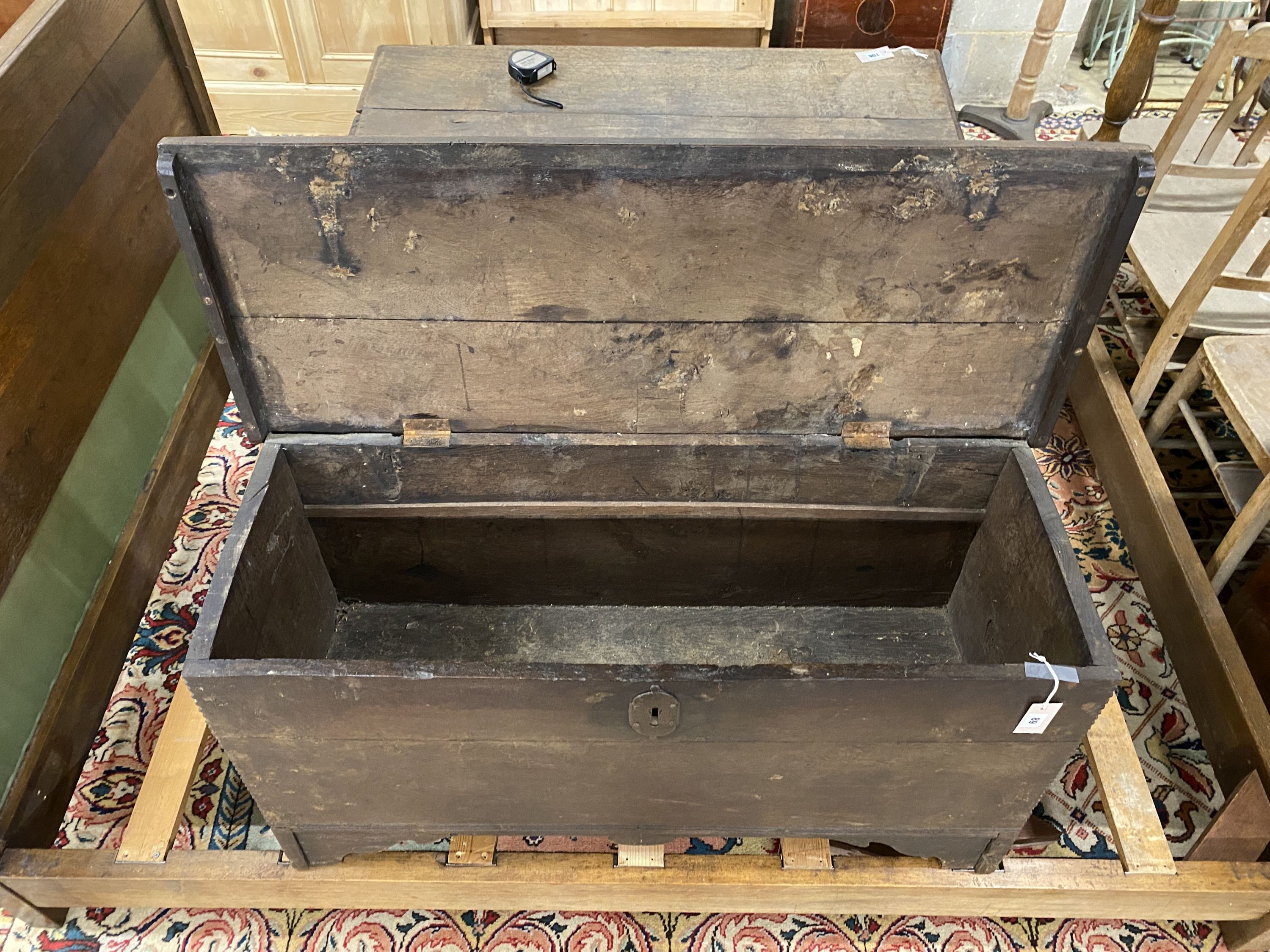 An 18th century oak coffer, length 111cm, depth 43cm, height 56cm